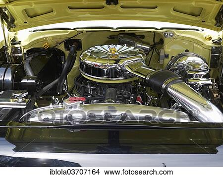 Picture - "Chromed engine compartment of a Chevrolet Bel Air classic car, Germany, Europe". Fotosearch