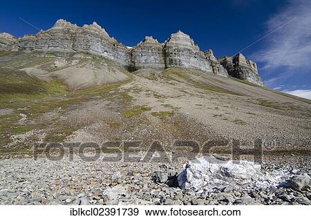 "Chunk of gypsum lying near the old gypsum mine below the bird cliffs of Skansen in Skansbukta, Billefjorden, Isfjorden, Spitsbergen, Svalbard, Norway, Europe" View Large Photo Image Stock Photo - "Chunk of gypsum lying near the old gypsum mine below the bird cliffs of Skansen in Skansbukta, Billefjorden, Isfjorden, Spitsbergen, Svalbard, Norway, Europe". Fotosearch