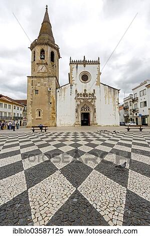 "Church and bell tower of Sao Joao Baptista with a geometric paving pattern on the marketplace of Tomar, Tomar, Santarem District, Portugal, Europe" View Large Photo Image Stock Photography - "Church and bell tower of Sao Joao Baptista with a geometric paving pattern on the marketplace of Tomar, Tomar, Santarem District, Portugal, Europe". Fotosearch