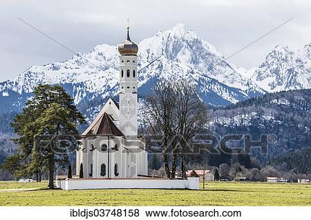 "Church of St. Coloman, in front of the snow-covered Alps, Schwangau, Ostallgau, Allgau, Schwabia, Bavaria, Germany, Europe" View Large Photo Image Stock Photo - "Church of St. Coloman, in front of the snow-covered Alps, Schwangau, Ostallgau, Allgau, Schwabia, Bavaria, Germany, Europe". Fotosearch