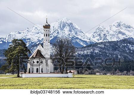 "Church of St. Coloman, in front of the snow-covered Alps, Schwangau, Ostallgau, Allgau, Schwabia, Bavaria, Germany, Europe" View Large Photo Image Stock Photograph - "Church of St. Coloman, in front of the snow-covered Alps, Schwangau, Ostallgau, Allgau, Schwabia, Bavaria, Germany, Europe". Fotosearch