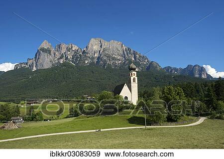 "Church of St. Constantine with Sciliar Mountain, Vols, Seiser Alm, South Tyrol province, Trentino-Alto Adige, Italy, Europe" View Large Photo Image Stock Photo - "Church of St. Constantine with Sciliar Mountain, Vols, Seiser Alm, South Tyrol province, Trentino-Alto Adige, Italy, Europe". Fotosearch