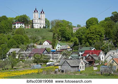 Stock Photo - "Church of St John the Baptist with the town of Seredzius, Lithuania, Baltic States, Europe". Fotosearch