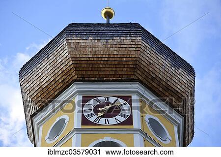 "Church spire, circa 1700, with a church clock, parish church of St. Martin, Fischbachau, Upper Bavaria, Bavaria, Germany, Europe" View Large Photo Image Stock Image - "Church spire, circa 1700, with a church clock, parish church of St. Martin, Fischbachau, Upper Bavaria, Bavaria, Germany, Europe". Fotosearch
