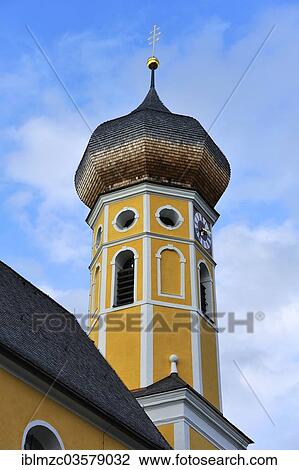 "Church spire, circa 1700, with a church clock, parish church of St. Martin, Fischbachau, Upper Bavaria, Bavaria, Germany, Europe" View Large Photo Image Stock Image - "Church spire, circa 1700, with a church clock, parish church of St. Martin, Fischbachau, Upper Bavaria, Bavaria, Germany, Europe". Fotosearch