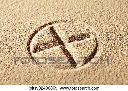 Stock Photography - "Circle with a cross, drawn in sand". Fotosearch