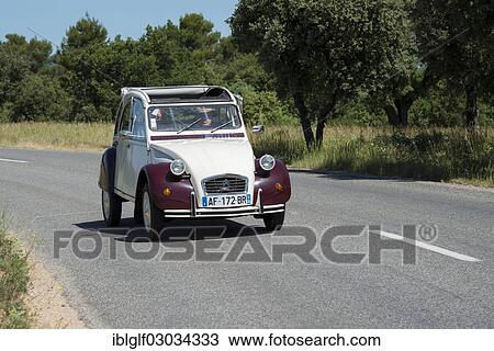 "Citroen 2CV, """"deux chevaux"""", car on a country road, Greoux-les-Bains, Provence-Alpes-Cote d? ÇÖAzur, France, Europe" View Large Photo Image Stock Image - "Citroen 2CV, """"deux chevaux"""", car on a country road, Greoux-les-Bains, Provence-Alpes-Cote d? ÇÖAzur, France, Europe". Fotosearch