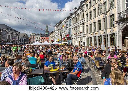 "City Festival Doudou, people celebrating in street cafes on Grand Place square, European Capital of Culture 2015, Mons, Wallonia, Belgium, Europe" View Large Photo Image Stock Photography - "City Festival Doudou, people celebrating in street cafes on Grand Place square, European Capital of Culture 2015, Mons, Wallonia, Belgium, Europe". Fotosearch