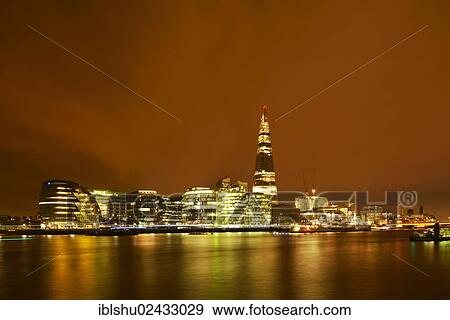 "City Hall, designed by Norman Foster, and The Shard or London Bridge Tower designed by Renzo Piano, at night, London, England, United Kingdom, Europe" View Large Photo Image Stock Photo - "City Hall, designed by Norman Foster, and The Shard or London Bridge Tower designed by Renzo Piano, at night, London, England, United Kingdom, Europe". Fotosearch