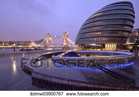 "City Hall designed by Sir Norman Foster, Tower Bridge at the back, at dusk, London, England, United Kingdom, Europe" View Large Photo Image Stock Photo - "City Hall designed by Sir Norman Foster, Tower Bridge at the back, at dusk, London, England, United Kingdom, Europe". Fotosearch