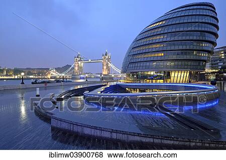 Stock Photo - "City Hall designed by Sir Norman Foster, Tower Bridge at the back, at dusk, London, England, United Kingdom, Europe". Fotosearch