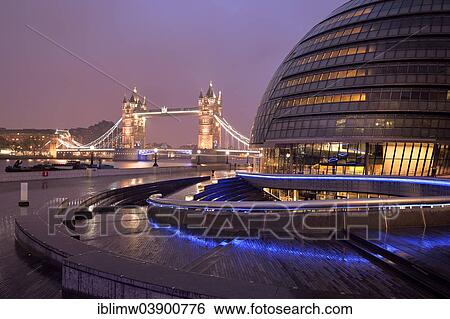 "City Hall designed by Sir Norman Foster, Tower Bridge at the back, at dusk, London, England, United Kingdom, Europe" View Large Photo Image Stock Photograph - "City Hall designed by Sir Norman Foster, Tower Bridge at the back, at dusk, London, England, United Kingdom, Europe". Fotosearch