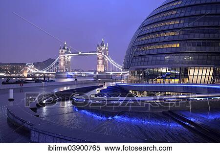 "City Hall designed by Sir Norman Foster, Tower Bridge at the back, at dusk, London, England, United Kingdom, Europe" View Large Photo Image Stock Photography - "City Hall designed by Sir Norman Foster, Tower Bridge at the back, at dusk, London, England, United Kingdom, Europe". Fotosearch