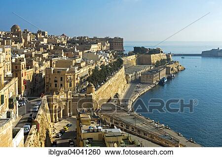 "Cityscape at the harbour between Victoria Gate and Lower Barakka Gardens, European Capital of Culture 2018, Valletta, Malta, Europe" View Large Photo Image Stock Image - "Cityscape at the harbour between Victoria Gate and Lower Barakka Gardens, European Capital of Culture 2018, Valletta, Malta, Europe". Fotosearch
