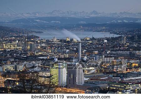 Stock Photo - "Cityscape, Lake Zurich at the rear, Swiss Alps on the horizon, Zurich, Switzerland, Europe". Fotosearch