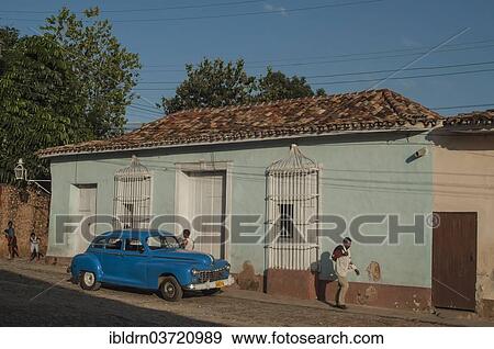 "Classic car outside a house, Trinidad, Sancti Spiritus Province, Cuba, North America" View Large Photo Image Stock Photo - "Classic car outside a house, Trinidad, Sancti Spiritus Province, Cuba, North America". Fotosearch