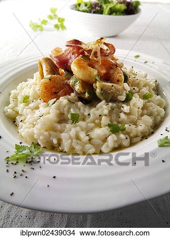 "Classic risotto with prawns, mussels and bacon" View Large Photo Image Picture - "Classic risotto with prawns, mussels and bacon". Fotosearch
