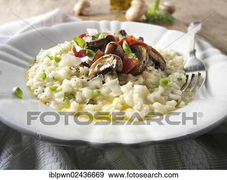 Classic risotto with wild porcini mushrooms and bacon View Large Photo Image Stock Photo - Classic risotto with wild porcini mushrooms and bacon. Fotosearch
