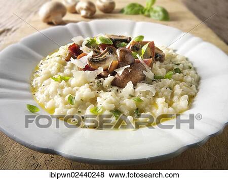 Classic risotto with wild porcini mushrooms and bacon View Large Photo Image Stock Photo - Classic risotto with wild porcini mushrooms and bacon. Fotosearch