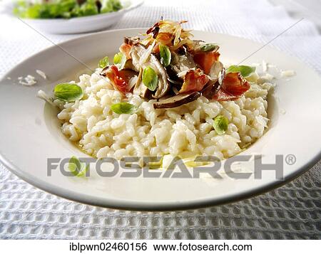 Classic risotto with wild porcini mushrooms and bacon View Large Photo Image Stock Photograph - Classic risotto with wild porcini mushrooms and bacon. Fotosearch