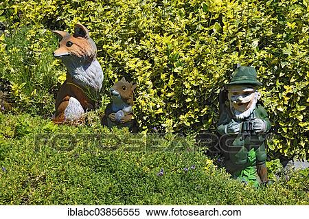 "Clay figures, fox, squirrel and a hunter in a garden, Bavaria, Germany, Europe" View Large Photo Image Stock Photography - "Clay figures, fox, squirrel and a hunter in a garden, Bavaria, Germany, Europe". Fotosearch