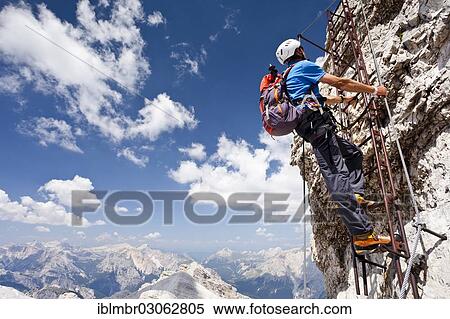 "Climber ascending Monte Cristallo via the Via ferrata Ivano Dibona climbing route, Dolomites, Province of Belluno, Veneto, Italy, Europe" View Large Photo Image Stock Photography - "Climber ascending Monte Cristallo via the Via ferrata Ivano Dibona climbing route, Dolomites, Province of Belluno, Veneto, Italy, Europe". Fotosearch