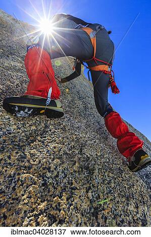 "Climber climbing on a rock wall, alpine climb, Alps, below the summit, Petite Forch, Canton of Valais, Switzerland, Europe" View Large Photo Image Stock Photo - "Climber climbing on a rock wall, alpine climb, Alps, below the summit, Petite Forch, Canton of Valais, Switzerland, Europe". Fotosearch