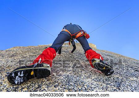 "Climber climbing on a rock wall, alpine climb, Alps, below the summit, Petite Forch, Canton of Valais, Switzerland, Europe" View Large Photo Image Stock Photograph - "Climber climbing on a rock wall, alpine climb, Alps, below the summit, Petite Forch, Canton of Valais, Switzerland, Europe". Fotosearch