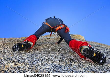 "Climber climbing on a rock wall, alpine climb, Alps, below the summit, Petite Forch, Canton of Valais, Switzerland, Europe" View Large Photo Image Stock Photography - "Climber climbing on a rock wall, alpine climb, Alps, below the summit, Petite Forch, Canton of Valais, Switzerland, Europe". Fotosearch