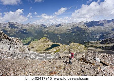 Climber descending from Schneebiger Nock mountain, Rieserfernergruppe mountain group, Puster valley, Lake Grosser Malersee below, province of Bolzano-Bozen, Italy, Europe View Large Photo Image Stock Photography - Climber descending from Schneebiger Nock mountain, Rieserfernergruppe mountain group, Puster valley, Lake Grosser Malersee below, province of Bolzano-Bozen, Italy, Europe. Fotosearch