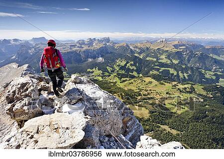 "Climber descending from the Zehnerspitze over the Zehner-Ferrata in the Fanes, Fanes-Senes-Prague, view of the Val Badia, the Puez and the Sella, Dolomites, South Tyrol, Italy, Europe" View Large Photo Image Stock Photograph - "Climber descending from the Zehnerspitze over the Zehner-Ferrata in the Fanes, Fanes-Senes-Prague, view of the Val Badia, the Puez and the Sella, Dolomites, South Tyrol, Italy, Europe". Fotosearch