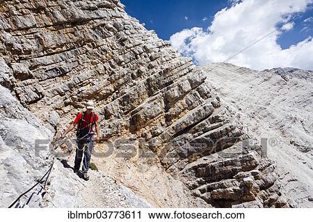 "Climber on the descent from Mt Monte Cristallo, Via Ferrata Ivano Dibona, Dolomites, Belluno, Italy, Europe" View Large Photo Image Stock Image - "Climber on the descent from Mt Monte Cristallo, Via Ferrata Ivano Dibona, Dolomites, Belluno, Italy, Europe". Fotosearch
