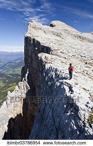 Picture - "Climber on the Kreuzkofelscharte, ascent to Heiligkreuzkofel over the Heiligkreuzkofelsteig in the nature park Fanes-Senes-Prague, behind the Heiligkreuzkofel, below the Val Badia, Dolomites, South Tyrol, Italy, Europe". Fotosearch
