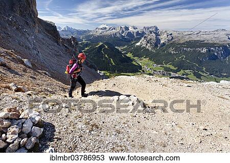 Stock Image - "Climber on the Kreuzkofelscharte, ascent to Heiligkreuzkofel over the Heiligkreuzkofelsteig in the nature park Fanes-Senes-Prague, below the Val Badia and Abtei, behind the Sella Group and the Puez, Dolomites, South Tyrol, Italy, Europe". Fotosearch