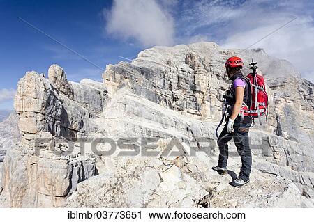 "Climber on the Via Ferrata Giuseppe di Olivieri, Mt Tofana di Mezzo at back, Dolomites, Belluno, Italy, Europe" View Large Photo Image Stock Image - "Climber on the Via Ferrata Giuseppe di Olivieri, Mt Tofana di Mezzo at back, Dolomites, Belluno, Italy, Europe". Fotosearch