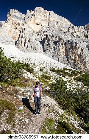 Stock Photo - "Climber on the way down over the Heiligkreuzkofelsteig from Heiligkreuzkofel, in the back the Fanes in the Fanes-Senes-Prague, Val Badia, Dolomites, South Tyrol, Italy, Europe". Fotosearch