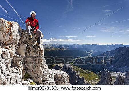 "Climber on top of the Croda Rossa di Sesto in the Dolomites of Sesto, view into the Sesto valley with the Kreuzberg Pass, Alta Pusteria, Dolomites, South Tyrol, Italy, Europe" View Large Photo Image Stock Photography - "Climber on top of the Croda Rossa di Sesto in the Dolomites of Sesto, view into the Sesto valley with the Kreuzberg Pass, Alta Pusteria, Dolomites, South Tyrol, Italy, Europe". Fotosearch