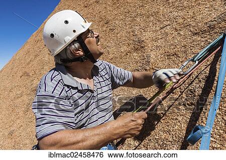 "Climber pulling a rope, Spitzkoppe area, Namibia, Africa" View Large Photo Image Stock Photograph - "Climber pulling a rope, Spitzkoppe area, Namibia, Africa". Fotosearch