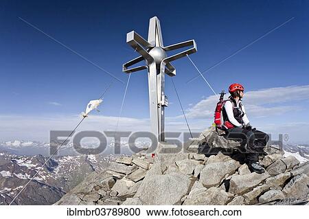 "Climbers at the summit cross of the Zuckerhutl, behind the Oetztal, right the Stubai Alps, North Tyrol, Austria, Europe" View Large Photo Image Stock Image - "Climbers at the summit cross of the Zuckerhutl, behind the Oetztal, right the Stubai Alps, North Tyrol, Austria, Europe". Fotosearch