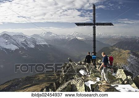 "Climbers on Bettmerhorn Mountain, overlooking the Rhone Valley and the Pennine Alps, Bettmeralp, Valais, Switzerland, Europe" View Large Photo Image Stock Photo - "Climbers on Bettmerhorn Mountain, overlooking the Rhone Valley and the Pennine Alps, Bettmeralp, Valais, Switzerland, Europe". Fotosearch