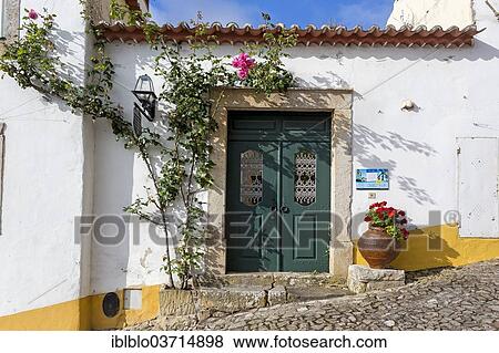"Climbing Rose around a door, Obidos, Leiria District, Portugal, Europe" View Large Photo Image Stock Photo - "Climbing Rose around a door, Obidos, Leiria District, Portugal, Europe". Fotosearch