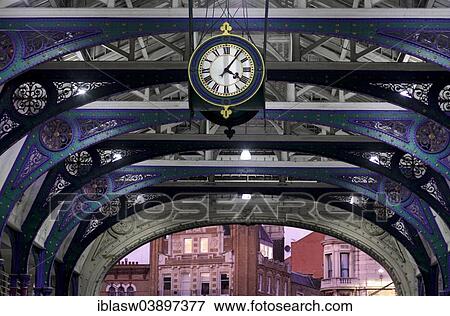 "Clock and wrought iron ornaments at dusk, Smithfield Market, City of London, London, England, United Kingdom, Europe" View Large Photo Image Stock Photo - "Clock and wrought iron ornaments at dusk, Smithfield Market, City of London, London, England, United Kingdom, Europe". Fotosearch