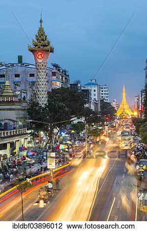"Clock tower, Sule Pagoda at the back, at dusk, blue hour, road traffic, Yangon or Rangoon, Yangon Region, Myanmar, Asia" View Large Photo Image Stock Image - "Clock tower, Sule Pagoda at the back, at dusk, blue hour, road traffic, Yangon or Rangoon, Yangon Region, Myanmar, Asia". Fotosearch