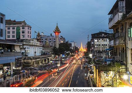 "Clock tower, Sule Pagoda at the back, at dusk, blue hour, road traffic, Yangon or Rangoon, Yangon Region, Myanmar, Asia" View Large Photo Image Stock Image - "Clock tower, Sule Pagoda at the back, at dusk, blue hour, road traffic, Yangon or Rangoon, Yangon Region, Myanmar, Asia". Fotosearch