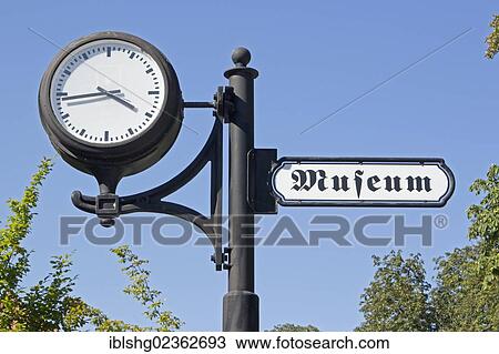 "Clock with a sign leading the way to the museum, Plau, Mecklenburg Lake District, Mecklenburg-Western Pomerania, Germany, Europe" View Large Photo Image Stock Image - "Clock with a sign leading the way to the museum, Plau, Mecklenburg Lake District, Mecklenburg-Western Pomerania, Germany, Europe". Fotosearch