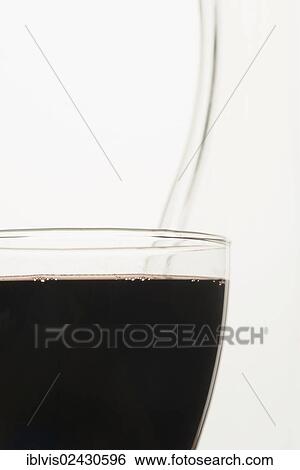 Stock Photograph - Close-up of a full glass of red wine. Fotosearch