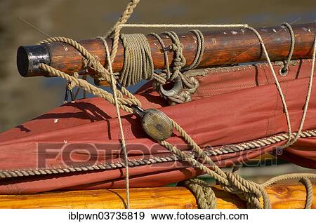 Stock Photo - "Close up of sail and mast of a Seine fishing boat, Honfleur harbour, Normandy, France, Europe". Fotosearch