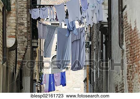 "Closely built houses, washing hanging on washing lines stretched over a lane, Castello, Venice, Venezia, Veneto, Italy, Europe" View Large Photo Image Stock Image - "Closely built houses, washing hanging on washing lines stretched over a lane, Castello, Venice, Venezia, Veneto, Italy, Europe". Fotosearch