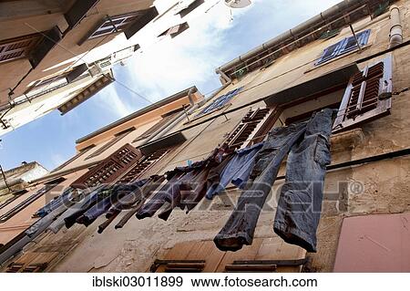 Stock Photo - "Clothes hanging to dry in an alley of the historic town centre of Rovinj, Rovingo, Istria, Croatia, Europe, Rovinj, Croatia, Europe". Fotosearch