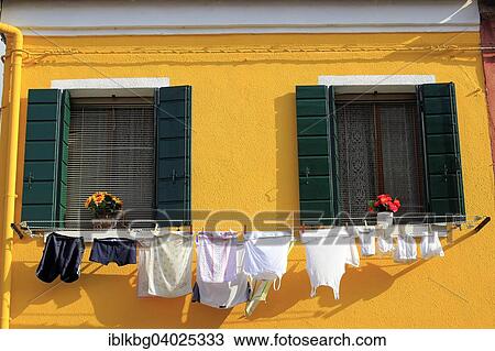 "Clothesline on a yellow facade, Burano, Venice, Veneto, Italy, Europe" View Large Photo Image Stock Image - "Clothesline on a yellow facade, Burano, Venice, Veneto, Italy, Europe". Fotosearch